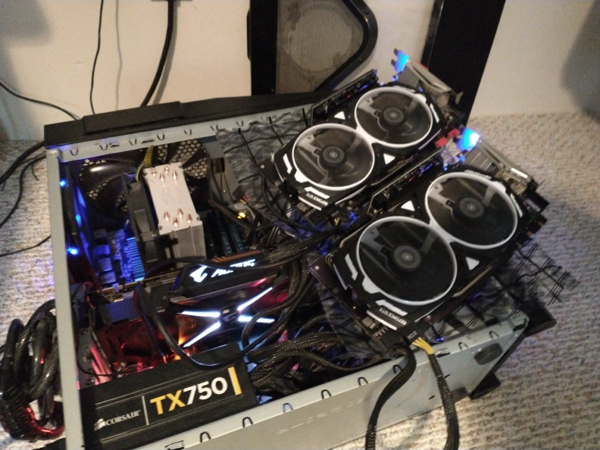 My old desktop PC with three 1080Tis crammed into it.  Forgive me, BigBlue.